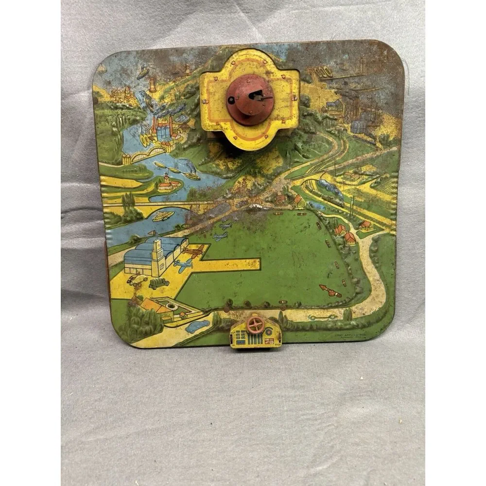 VINTAGE ALL METAL FUTURMATIC AIRPORT BY AUTOMATIC TOY CO. WIND-UP TOY‎